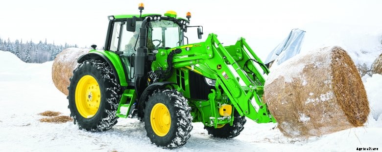 John Deere 6R tractor mowing